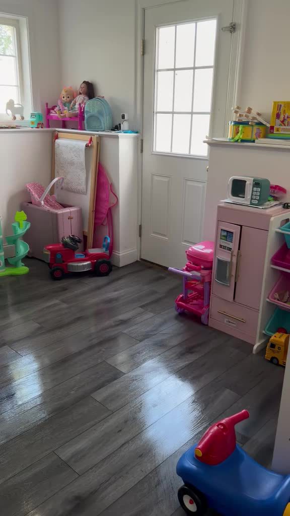 Freshly mopped, gleaming floor in a playroom